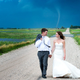 Illustration for article titled Couple gets their wedding photos with a tornado in the background